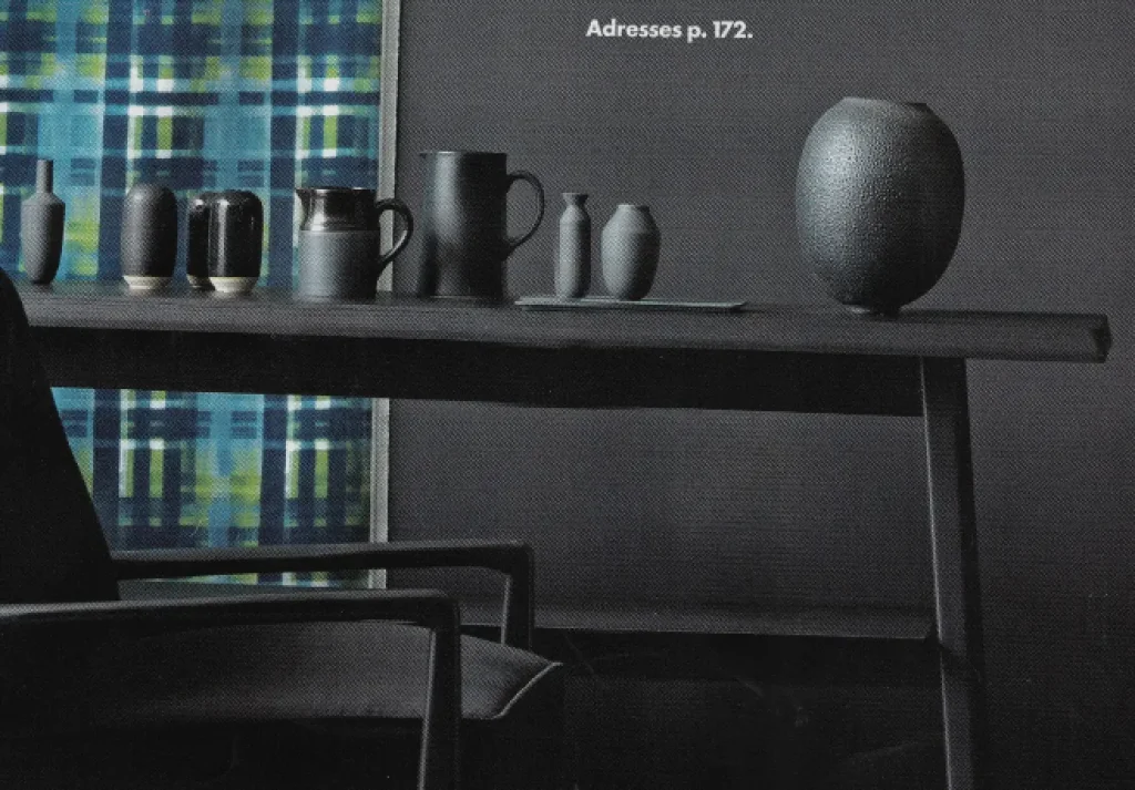 press contemporary ceramics, parisian creation with pure lines, illustrating the craftsmanship of integrated french art pottery, in a refined setting